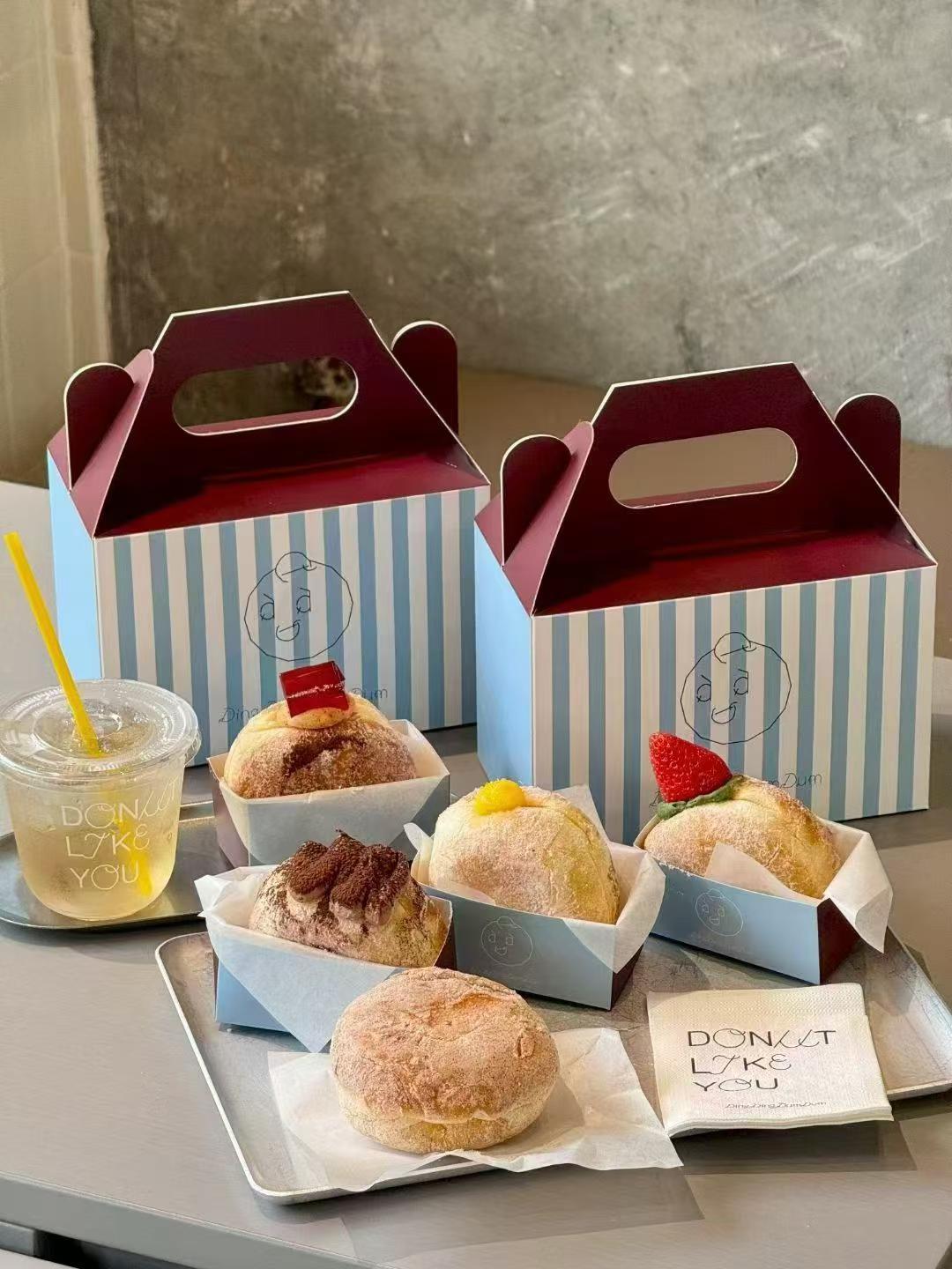 Reference photo showing branded bakery and cafe packaging formats.