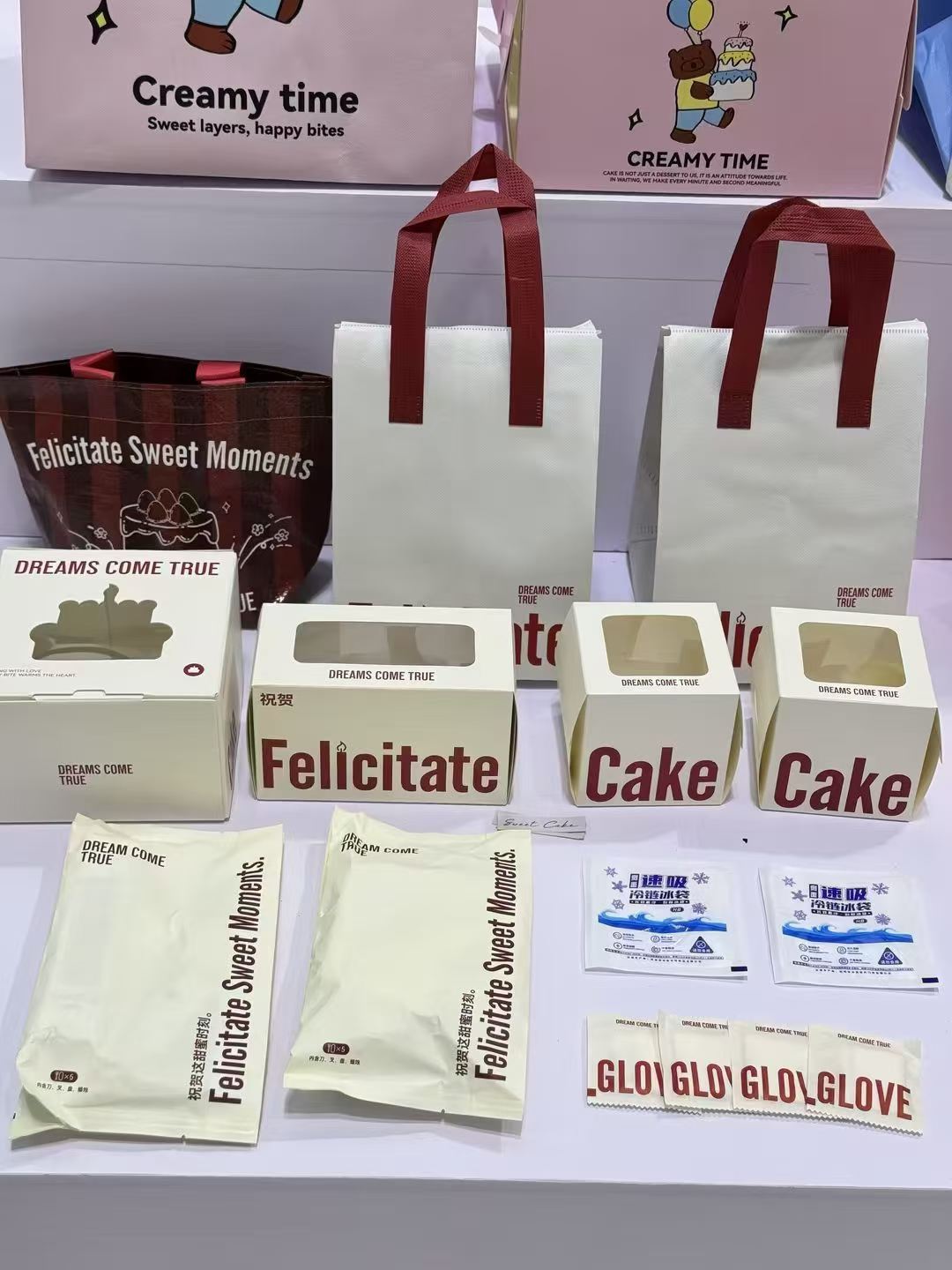 Reference photo showing coordinated cake boxes, paper bags and food wraps.