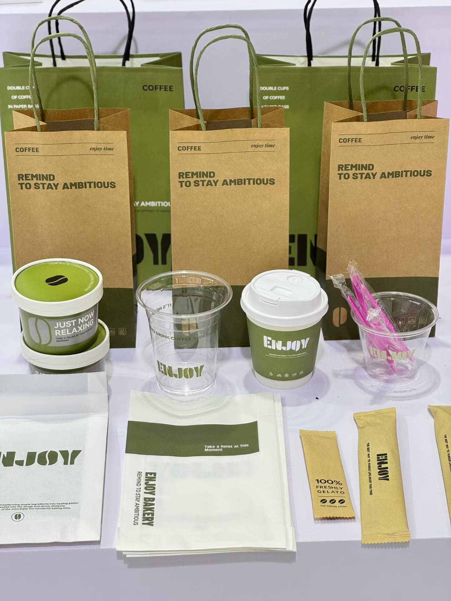 Reference photo showing a coordinated branded packaging set direction.